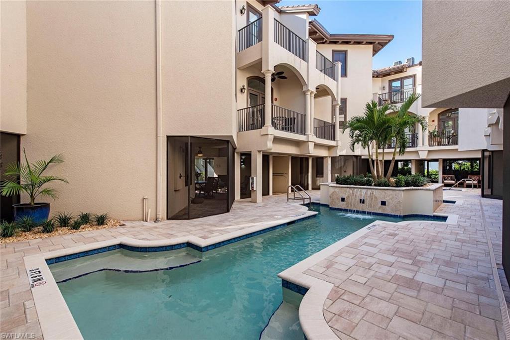 1012 7th Street South, Unit B2 Naples, FL 34102 - Photo 17 of 17 a view of a house with swimming pool