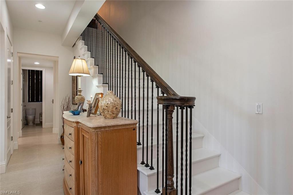 1012 7th Street South, Unit B2 Naples, FL 34102 - Photo 3 of 17 a view of a hallway with washer and dryer