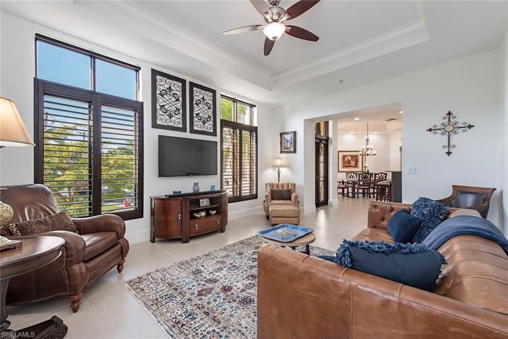 1012 7th Street South, Unit B2 Naples, FL 34102 - Photo 5 of 17 a living room with furniture and a flat screen tv