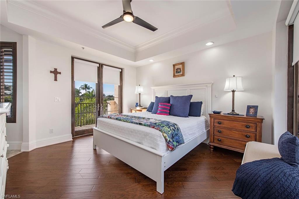 1012 7th Street South, Unit B2 Naples, FL 34102 - Photo 8 of 17 a bedroom with a bed and window