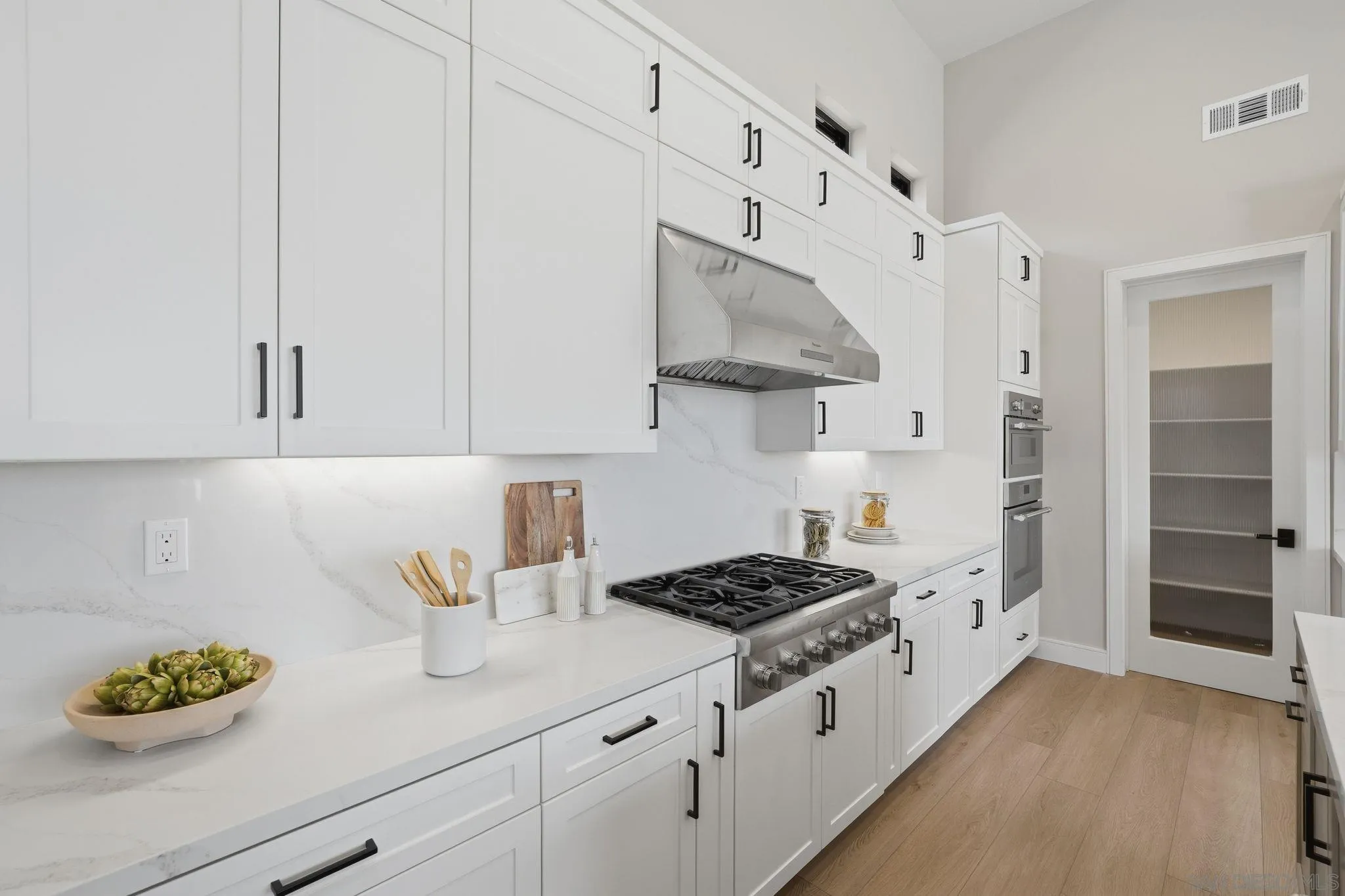 3916 Citrus Drive Fallbrook, CA 92028 - Photo 15 of 72 a kitchen with white cabinets and stove
