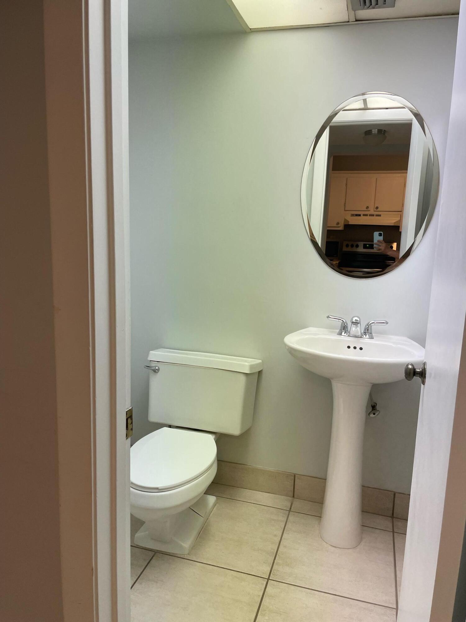 9440 Southwest 8th Street, Unit 217 Boca Raton, FL 33428 - Photo 14 of 28 Half bathroom