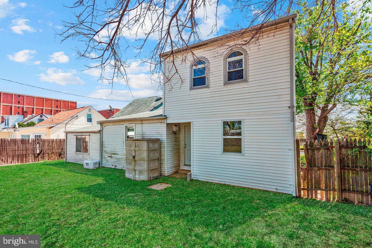 6800 Crossway Baltimore, MD 21222 - Photo 2 of 14 a front view of house with yard and green space