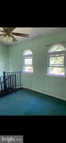 a view of room with window and hardwood floor