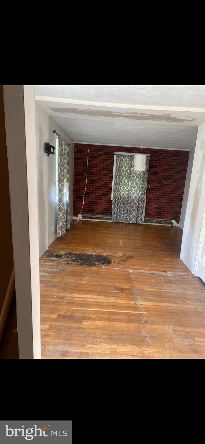 6800 Crossway Baltimore, MD 21222 - Photo 7 of 14 a view of room with window and hardwood floor