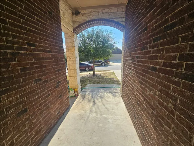 a view of a pathway both side of house
