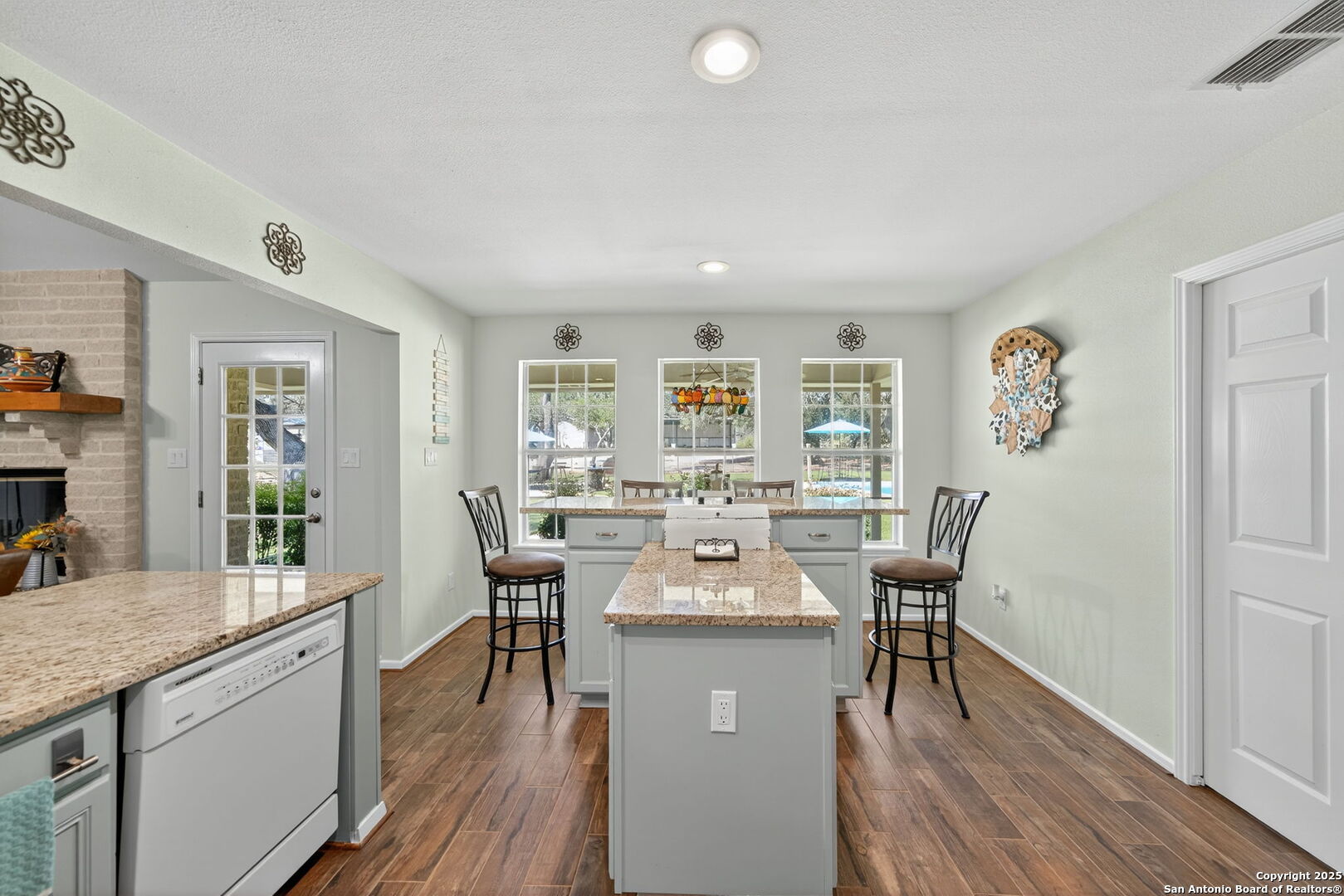 231 Hayden Road Pleasanton, TX 78064 - Photo 12 of 36 a view of a dining room with furniture window and wooden floor