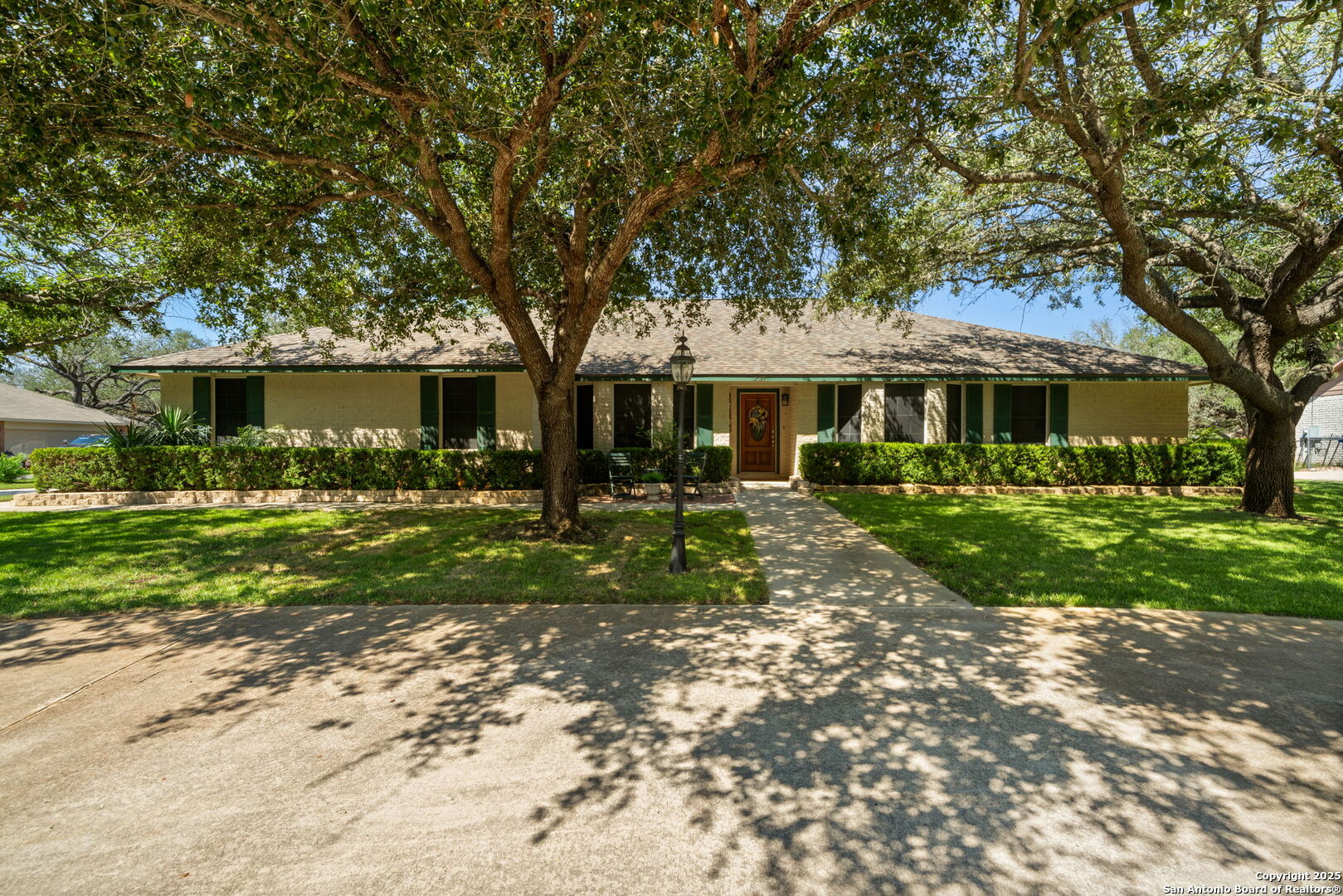 231 Hayden Road Pleasanton, TX 78064 - Photo 2 of 36 a front view of a house with garden
