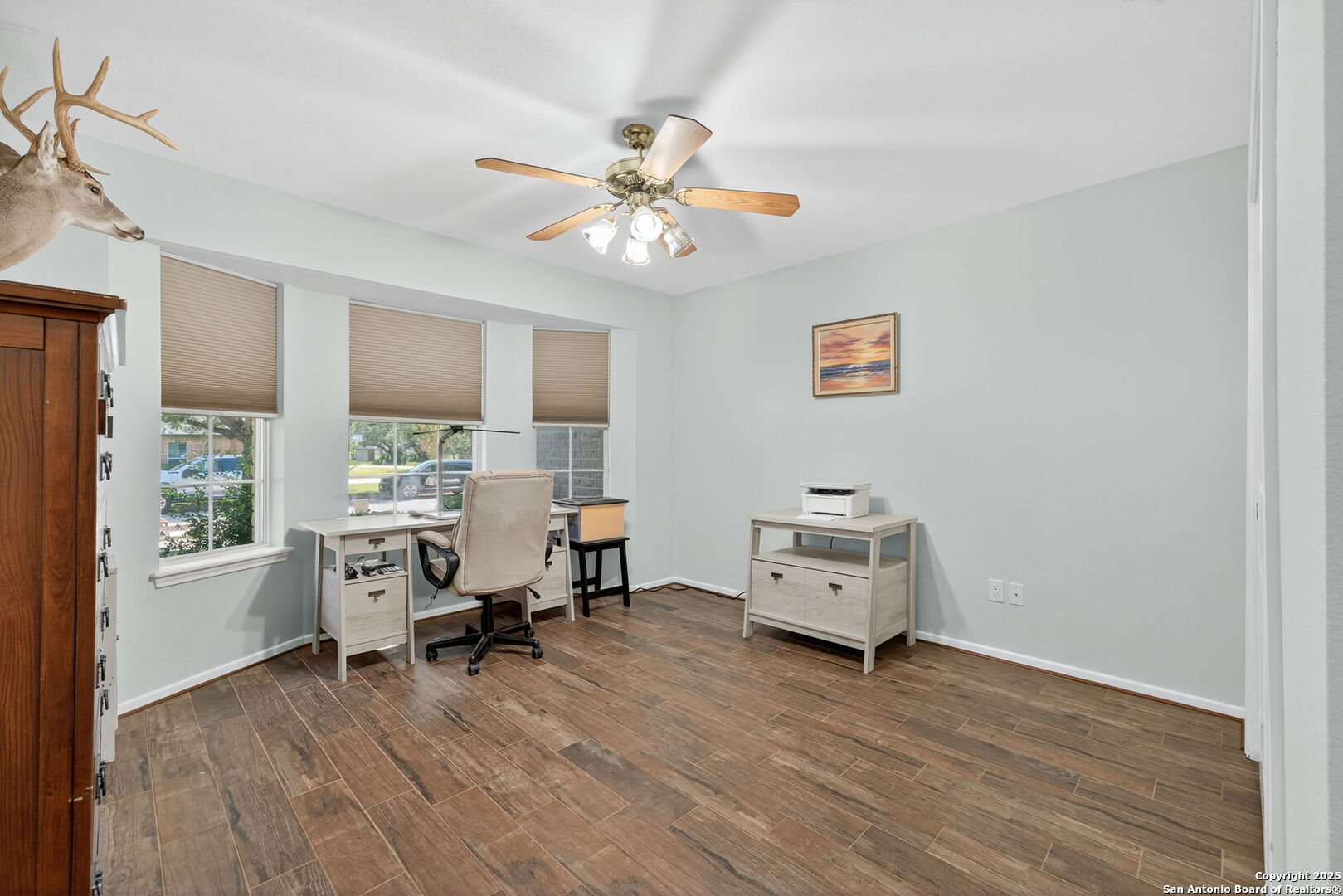 231 Hayden Road Pleasanton, TX 78064 - Photo 27 of 36 a workspace with furniture window and wooden floor