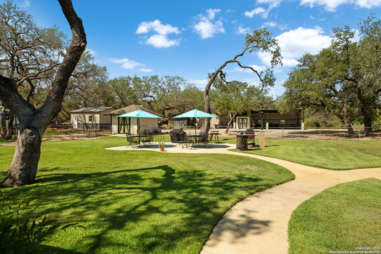 231 Hayden Road Pleasanton, TX 78064 - Photo 28 of 36 a swimming pool with outdoor seating and yard