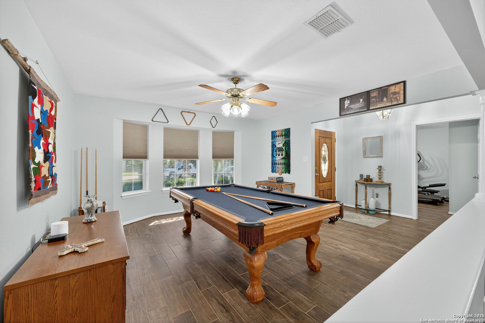 231 Hayden Road Pleasanton, TX 78064 - Photo 8 of 36 a room with furniture pool table flat screen tv and windows