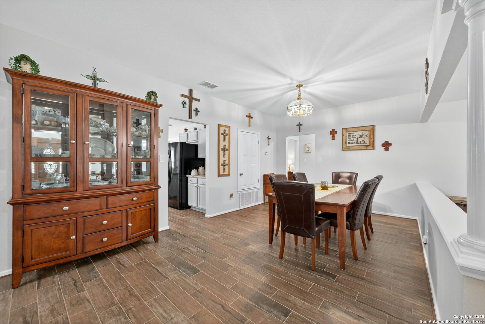 231 Hayden Road Pleasanton, TX 78064 - Photo 9 of 36 a view of a dining room with furniture window and wooden floor