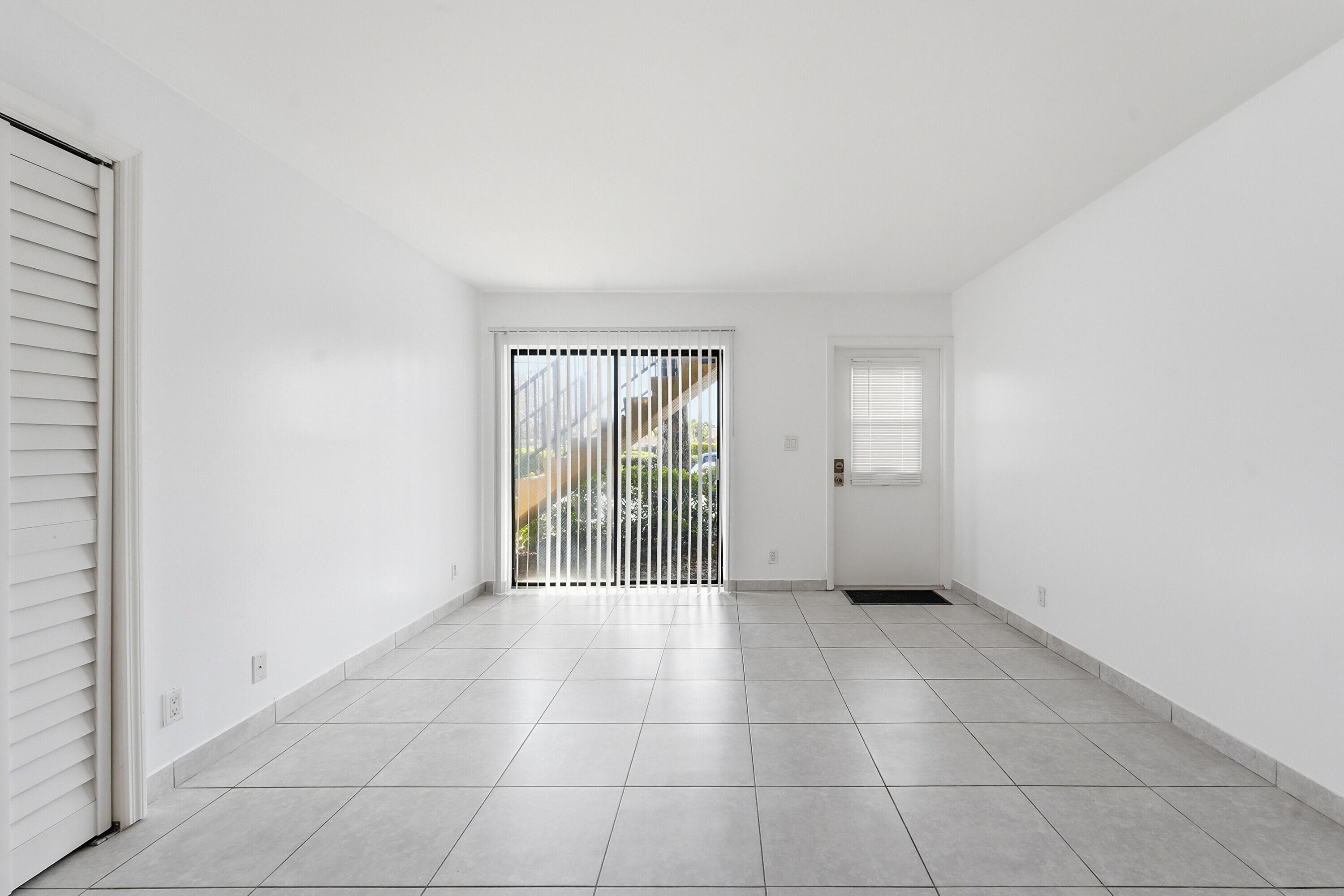 2671 Riverside Drive, Unit 1 Coral Springs, FL 33065 - Photo 20 of 25 a view of an empty room with a window