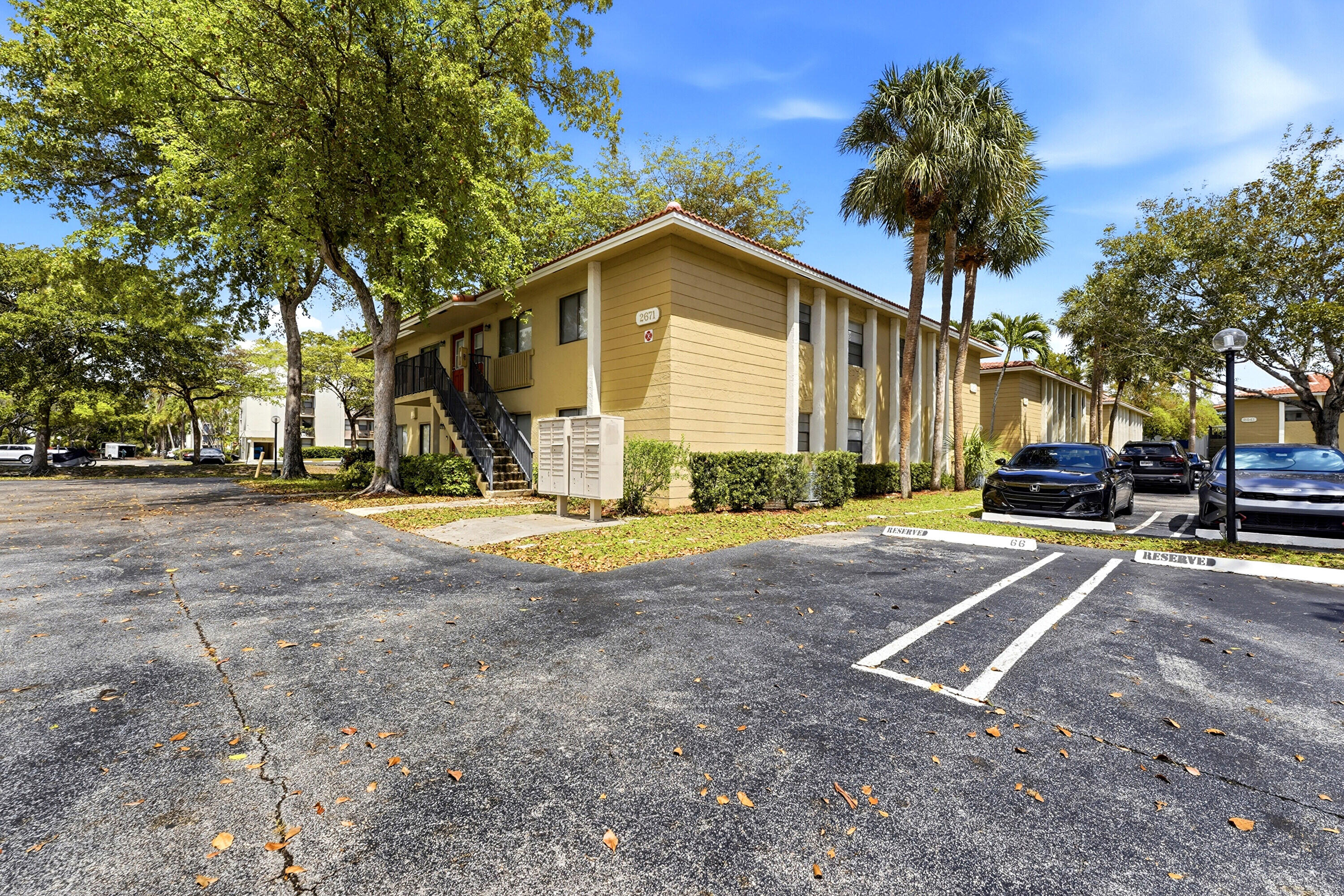 2671 Riverside Drive, Unit 1 Coral Springs, FL 33065 - Photo 24 of 25 a view of a house with outdoor space and parking