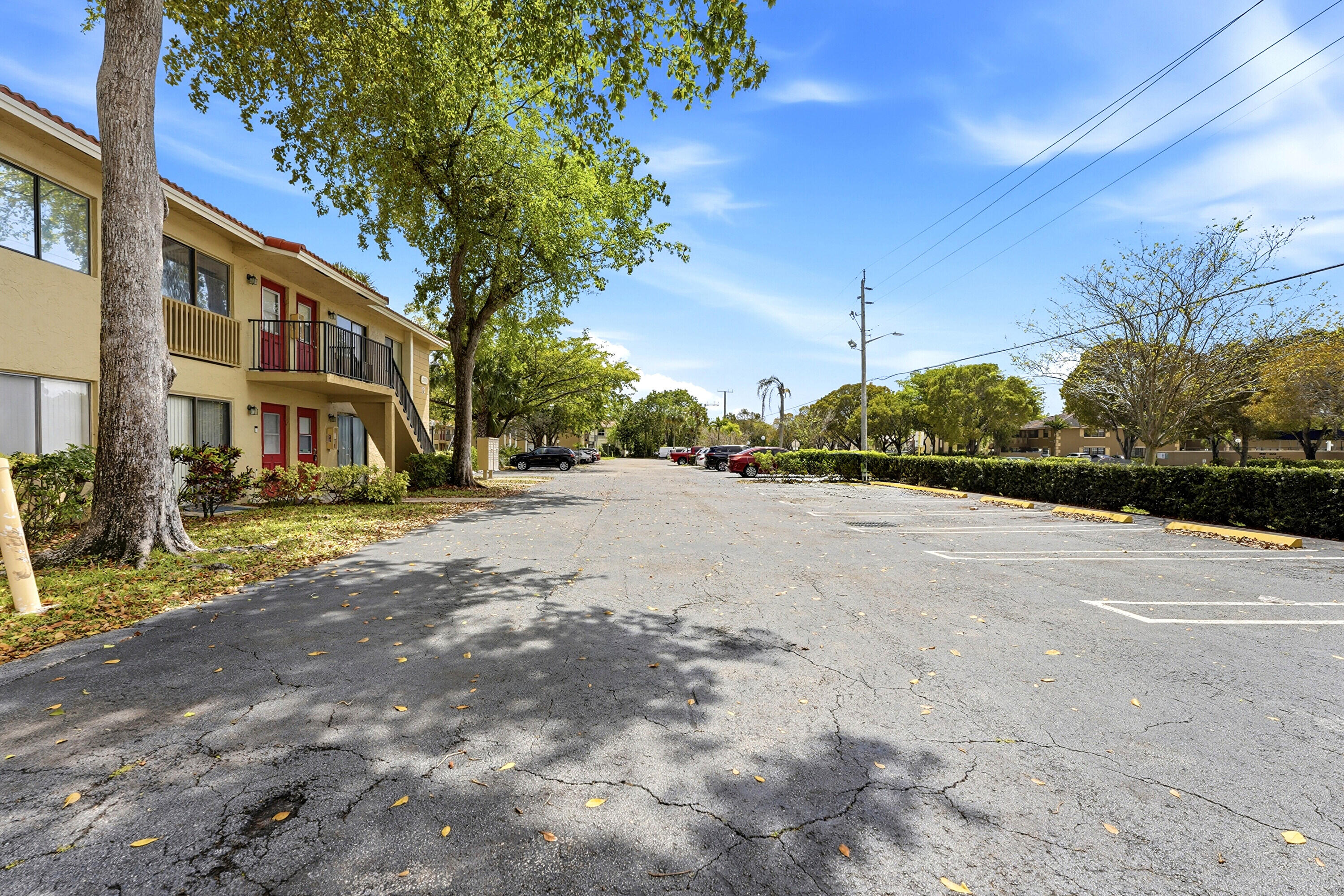 2671 Riverside Drive, Unit 1 Coral Springs, FL 33065 - Photo 25 of 25 a view of road with house and trees in the background