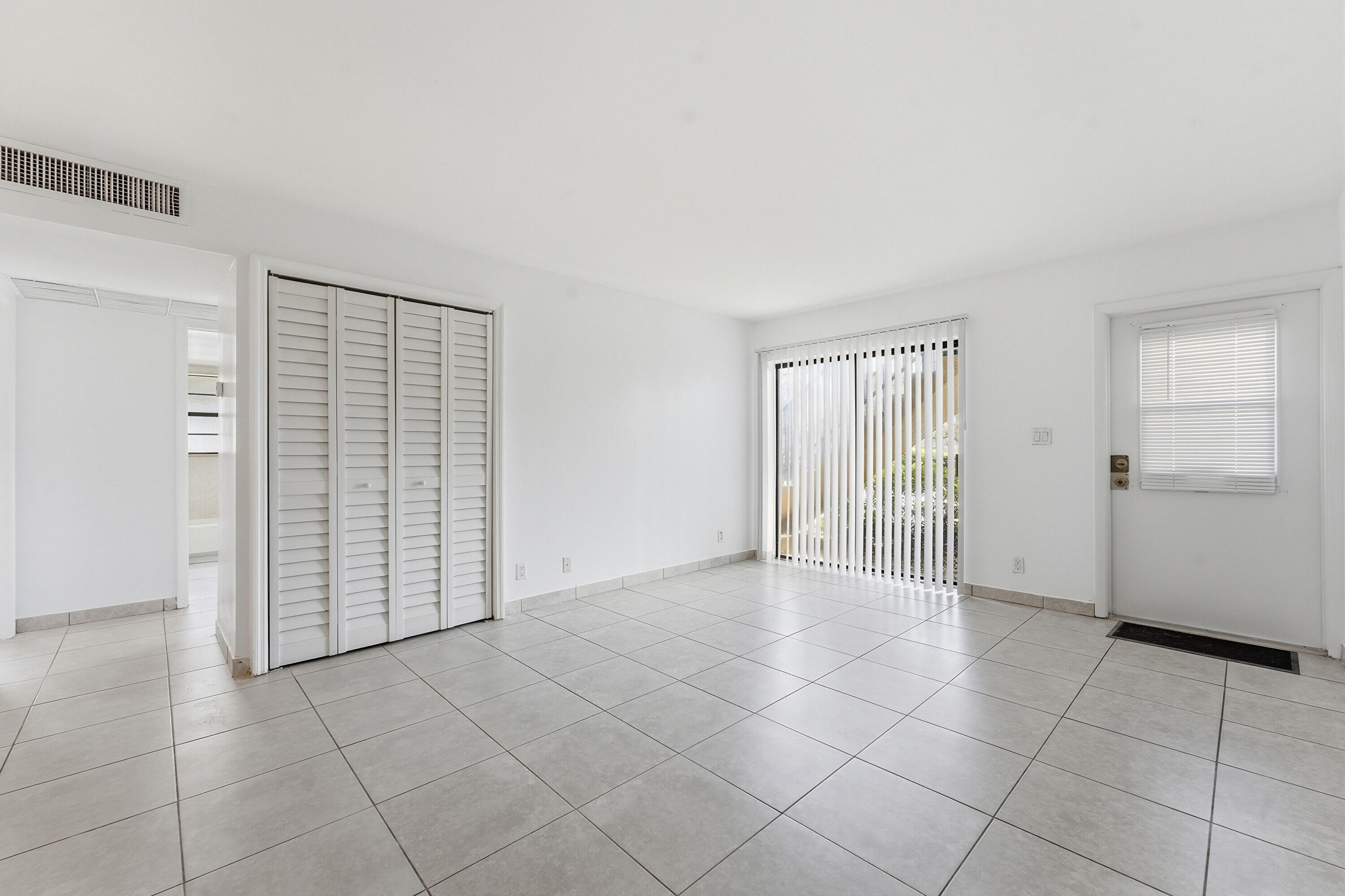 2671 Riverside Drive, Unit 1 Coral Springs, FL 33065 - Photo 5 of 25 an empty room with windows
