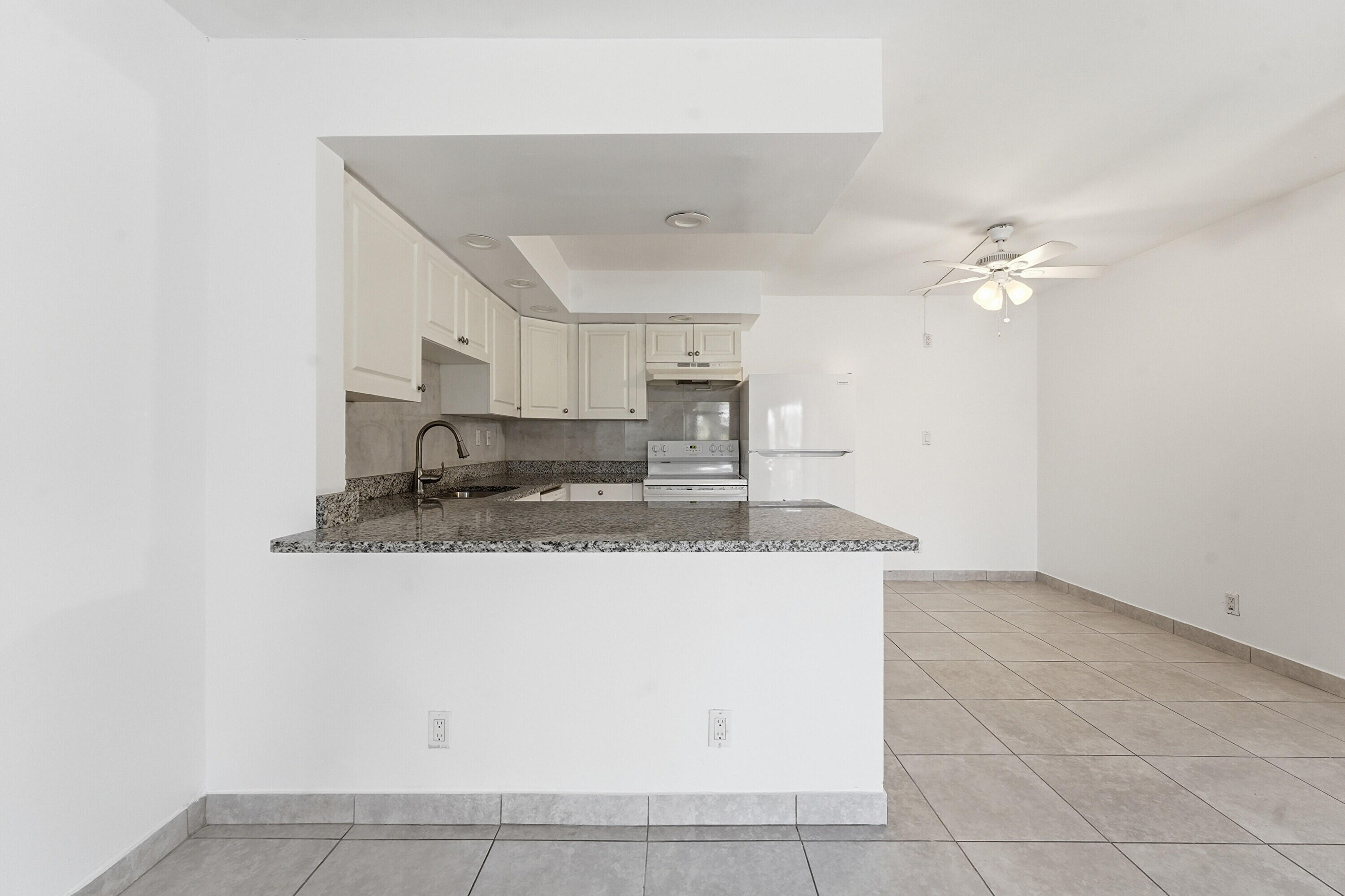 2671 Riverside Drive, Unit 1 Coral Springs, FL 33065 - Photo 9 of 25 a view of a kitchen with a sink