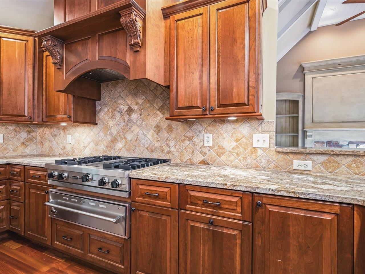 12936 Melrose Road Caledonia, IL 61011 - Photo 17 of 94 a kitchen with granite countertop a stove a sink and dishwasher
