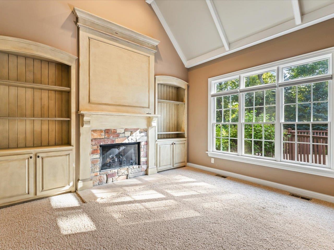 12936 Melrose Road Caledonia, IL 61011 - Photo 26 of 94 a view of a livingroom with a fireplace and windows
