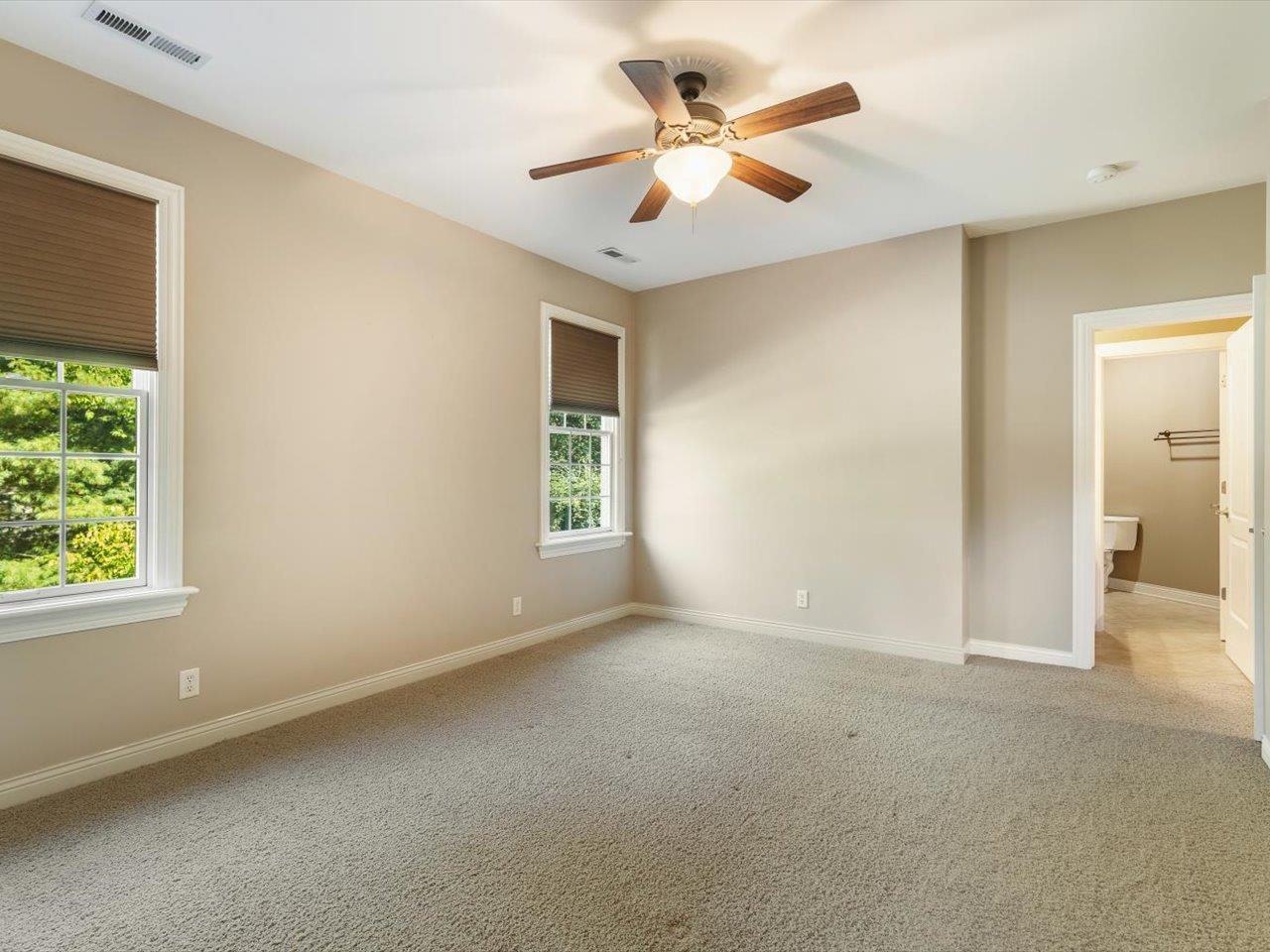 12936 Melrose Road Caledonia, IL 61011 - Photo 50 of 94 an empty room with a ceiling fan and a window