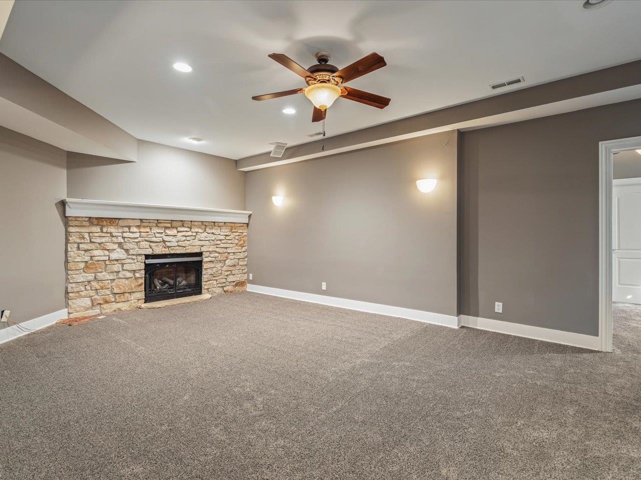 12936 Melrose Road Caledonia, IL 61011 - Photo 66 of 94 a view of an empty room with a fireplace