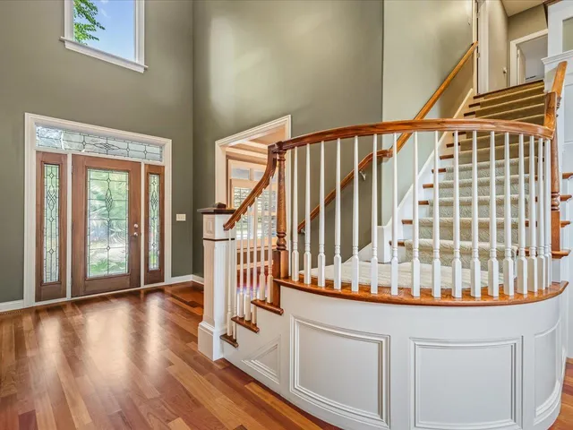 a kitchen with stainless steel appliances granite countertop wooden cabinets a stove a sink and dishwasher