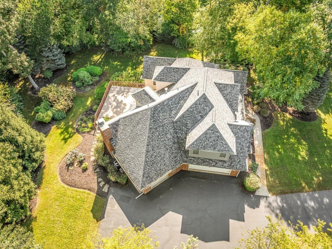 12936 Melrose Road Caledonia, IL 61011 - Photo 88 of 94 an aerial view of a house with a yard basket ball court and outdoor seating