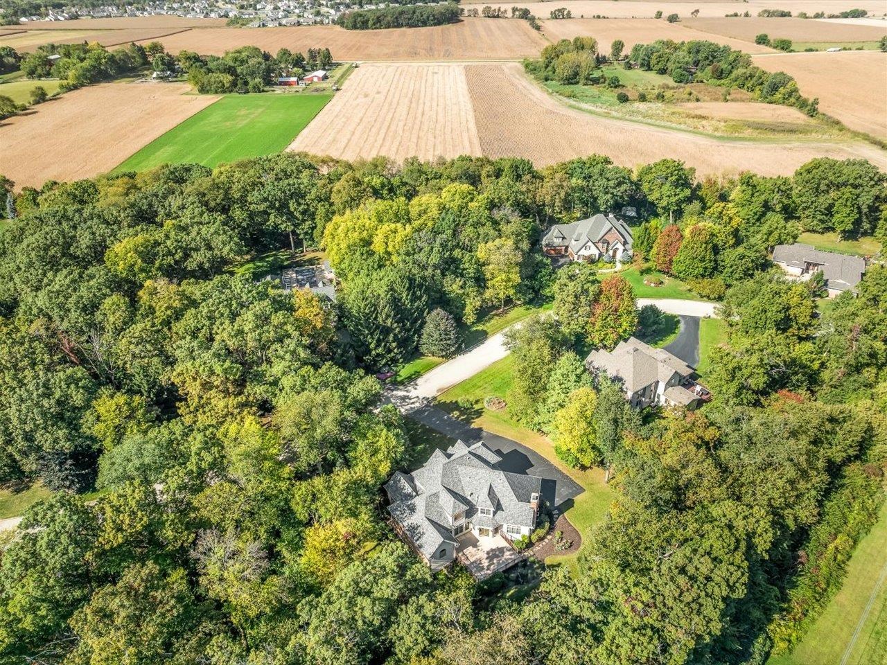12936 Melrose Road Caledonia, IL 61011 - Photo 90 of 94 an aerial view of a house with a yard and lake view