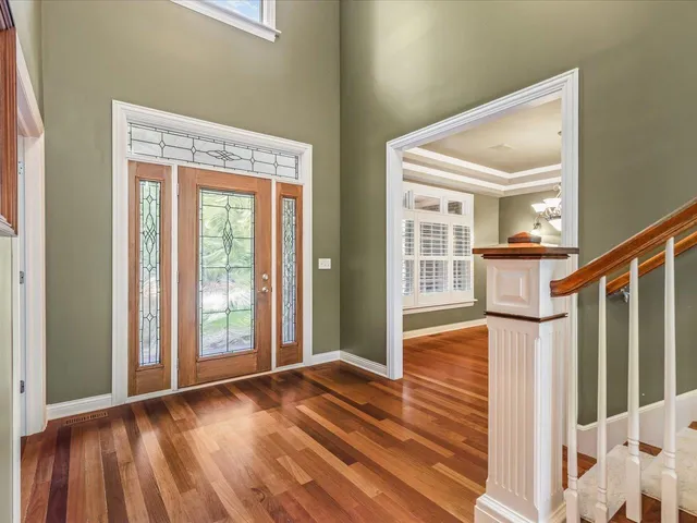 a kitchen with granite countertop a stove a sink and dishwasher