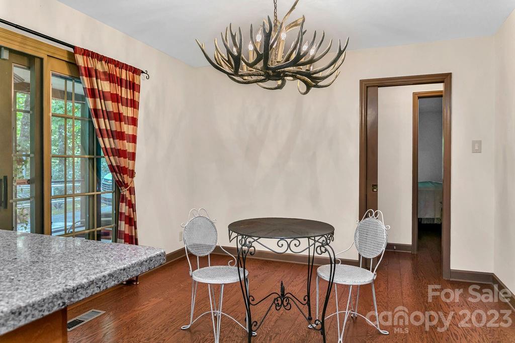 330 Beau Valley Road Tryon, NC 28782 - Photo 11 of 42 a dining room with furniture and wooden floor