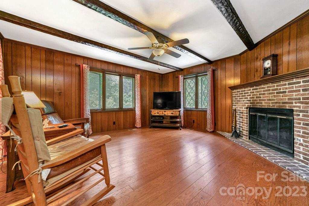 330 Beau Valley Road Tryon, NC 28782 - Photo 17 of 42 a living room with furniture a fireplace and flat screen tv
