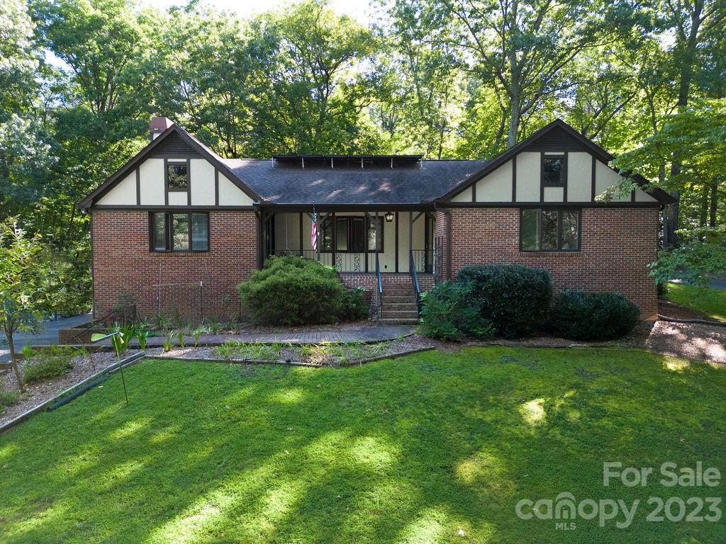 330 Beau Valley Road Tryon, NC 28782 - Photo 2 of 42 a front view of house with yard and green space