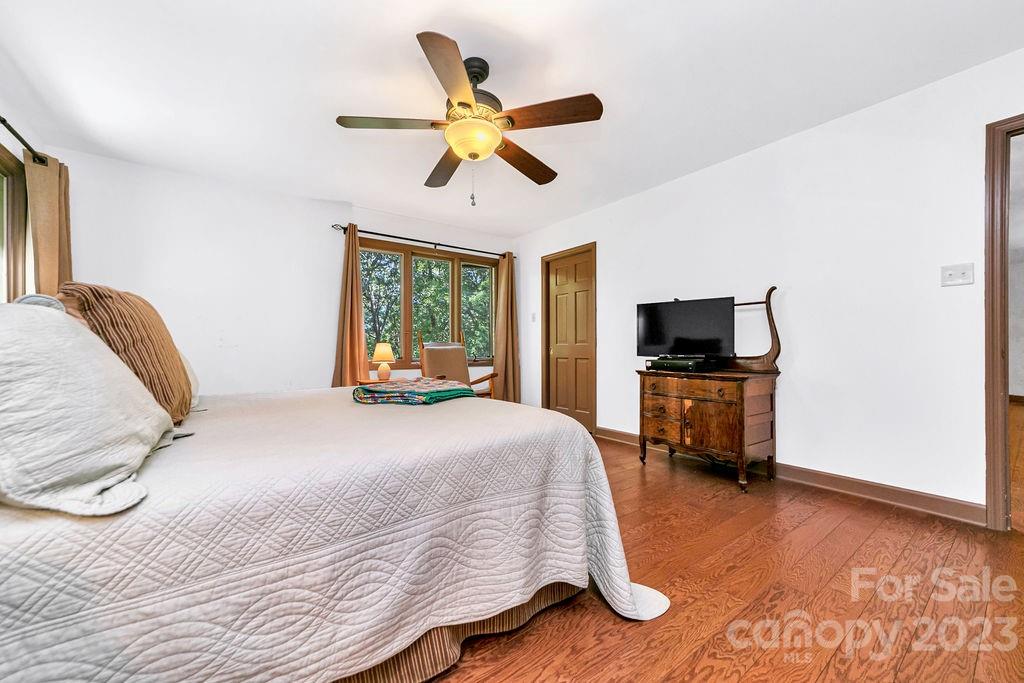 330 Beau Valley Road Tryon, NC 28782 - Photo 23 of 42 a bedroom with a bed and a tv