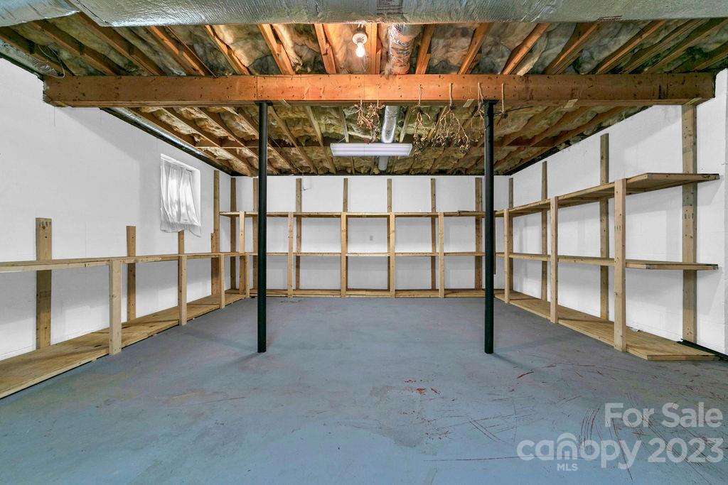 330 Beau Valley Road Tryon, NC 28782 - Photo 32 of 42 a view of an empty room with racks on the wall