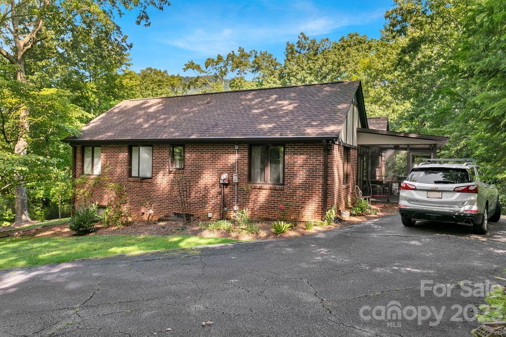330 Beau Valley Road Tryon, NC 28782 - Photo 35 of 42 a car parked in front of a house