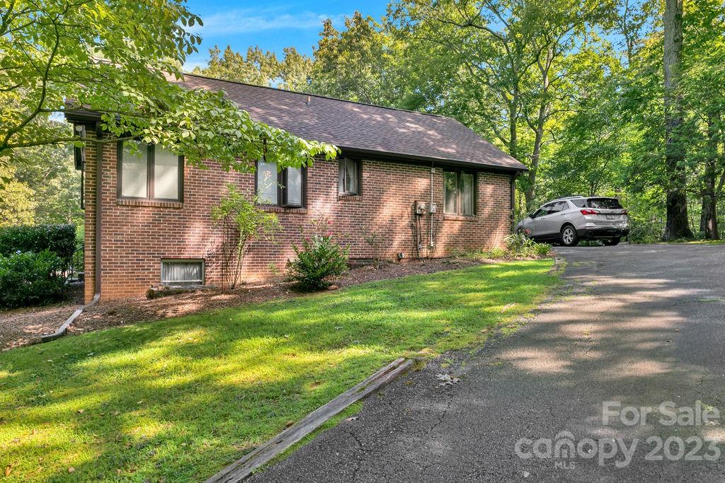 330 Beau Valley Road Tryon, NC 28782 - Photo 36 of 42 a view of a house with backyard and sitting area