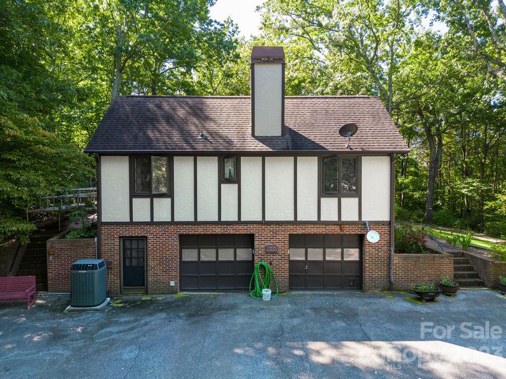 330 Beau Valley Road Tryon, NC 28782 - Photo 37 of 42 a front view of a house with parking garage