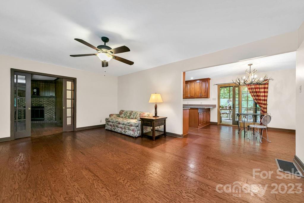 330 Beau Valley Road Tryon, NC 28782 - Photo 8 of 42 a living room with furniture and a wooden floor