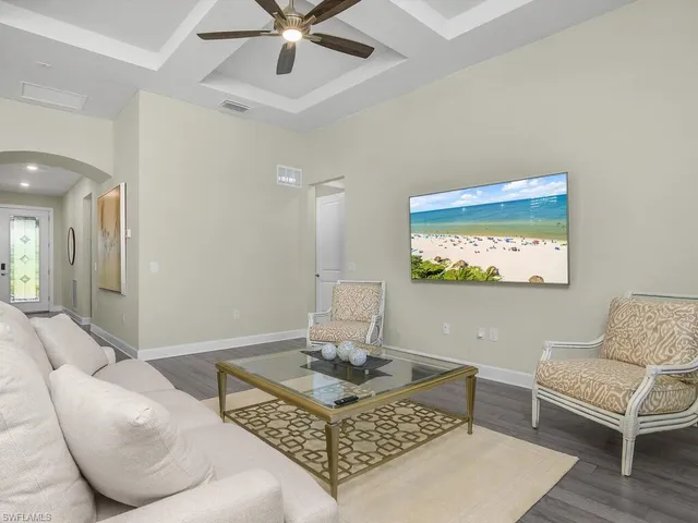 a living room with furniture and a window
