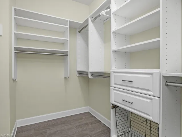 a bathroom with a shower sink and mirror