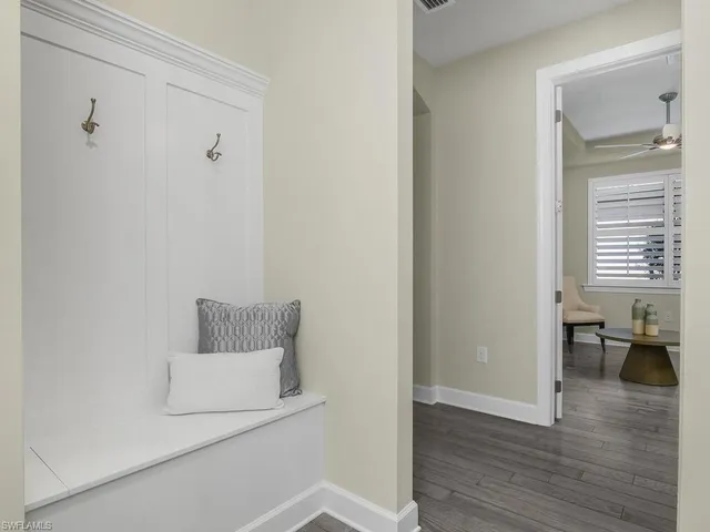 a view of room with window and wooden floor