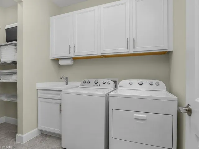 a building outdoor space with patio furniture and garden