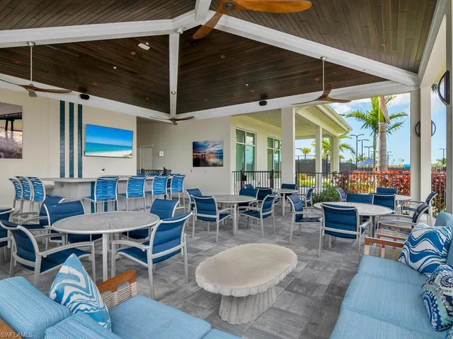 a view of a white house with a yard