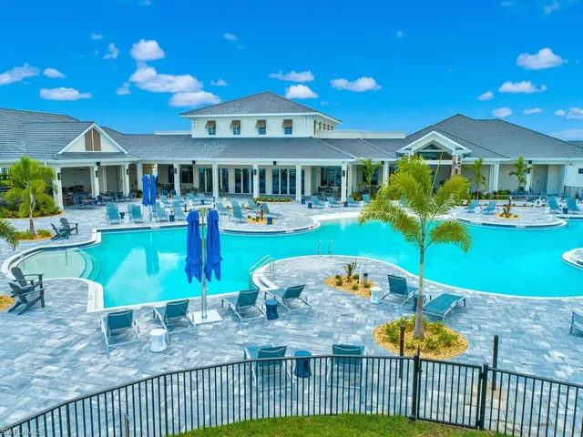 a view of a patio with dining table and chairs