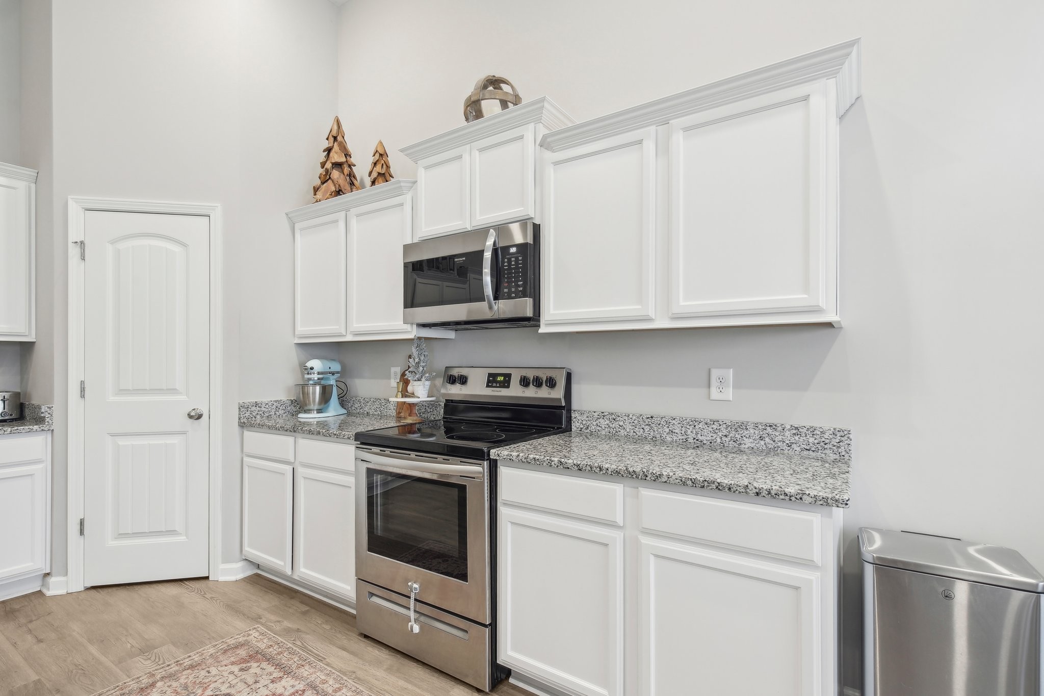 211 Thorpe Dr Spring Hill Spring Hill, TN 37174 - Photo 17 of 38 a kitchen with granite countertop white cabinets stainless steel appliances and sink