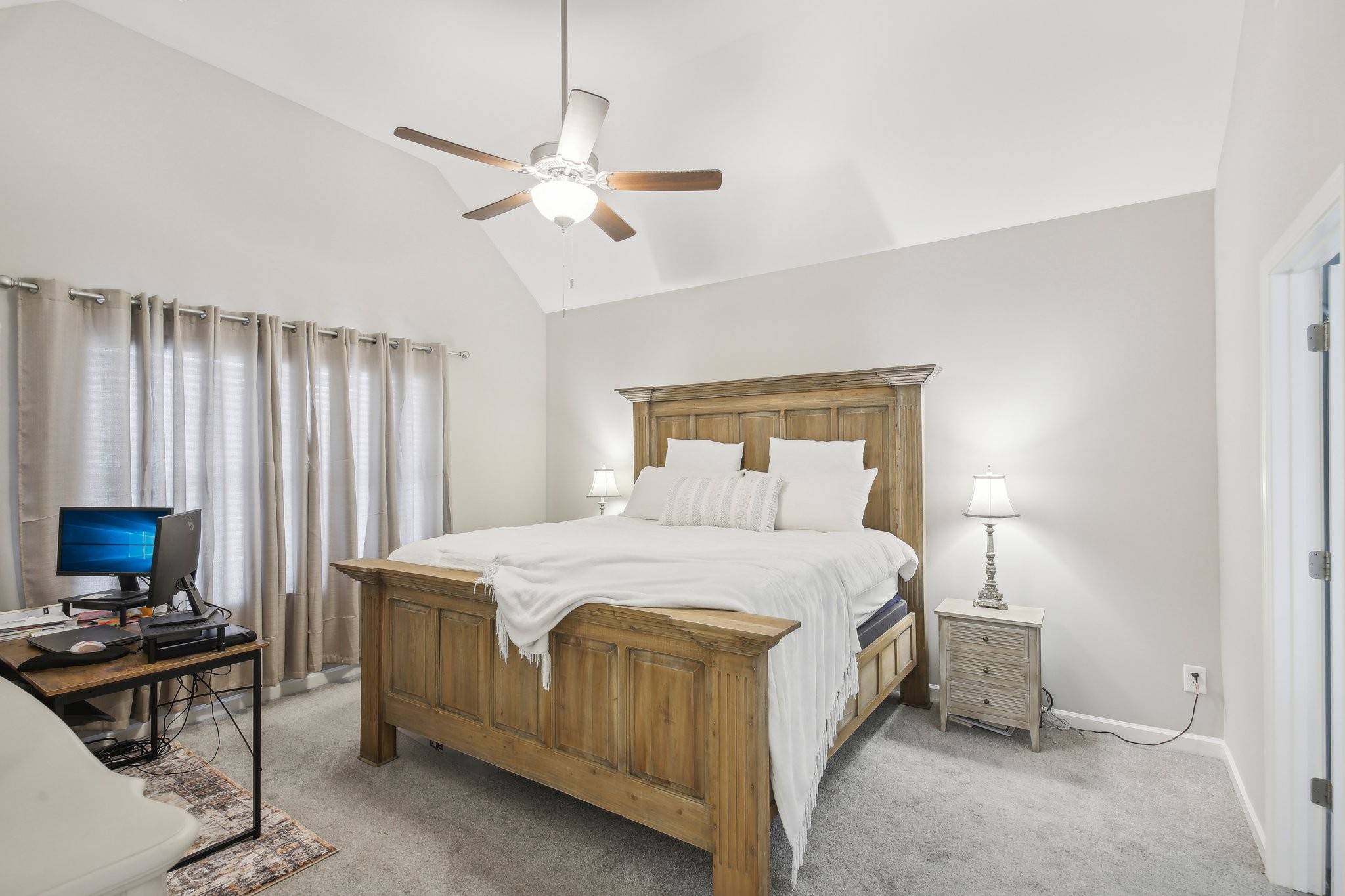 211 Thorpe Dr Spring Hill Spring Hill, TN 37174 - Photo 21 of 38 a bedroom with a bed and a chandelier