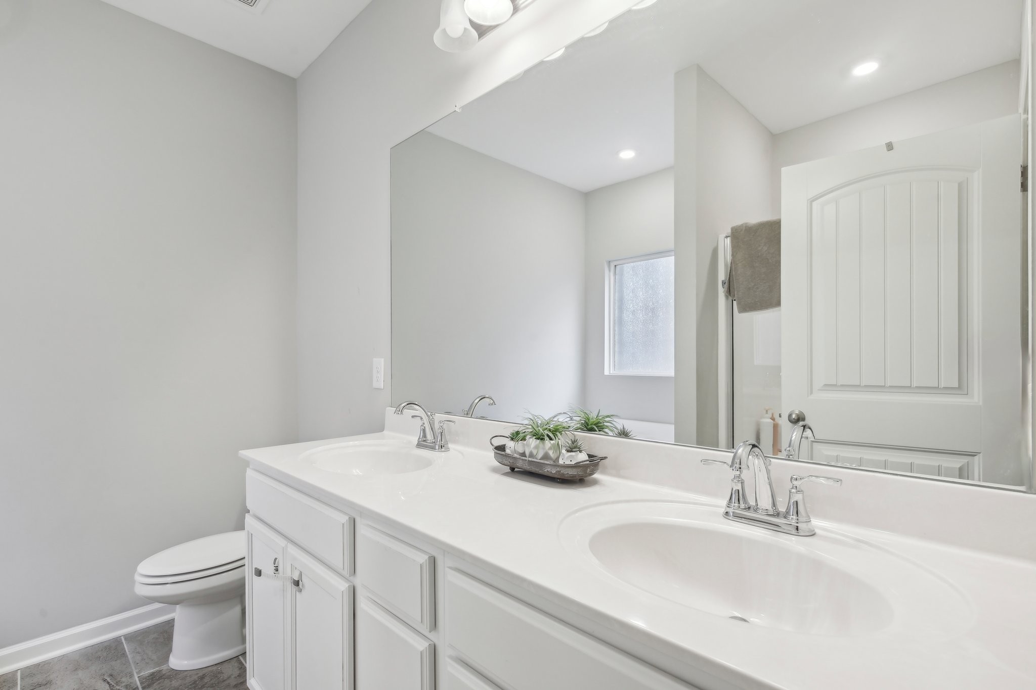 211 Thorpe Dr Spring Hill Spring Hill, TN 37174 - Photo 22 of 38 a bathroom with a sink and a mirror