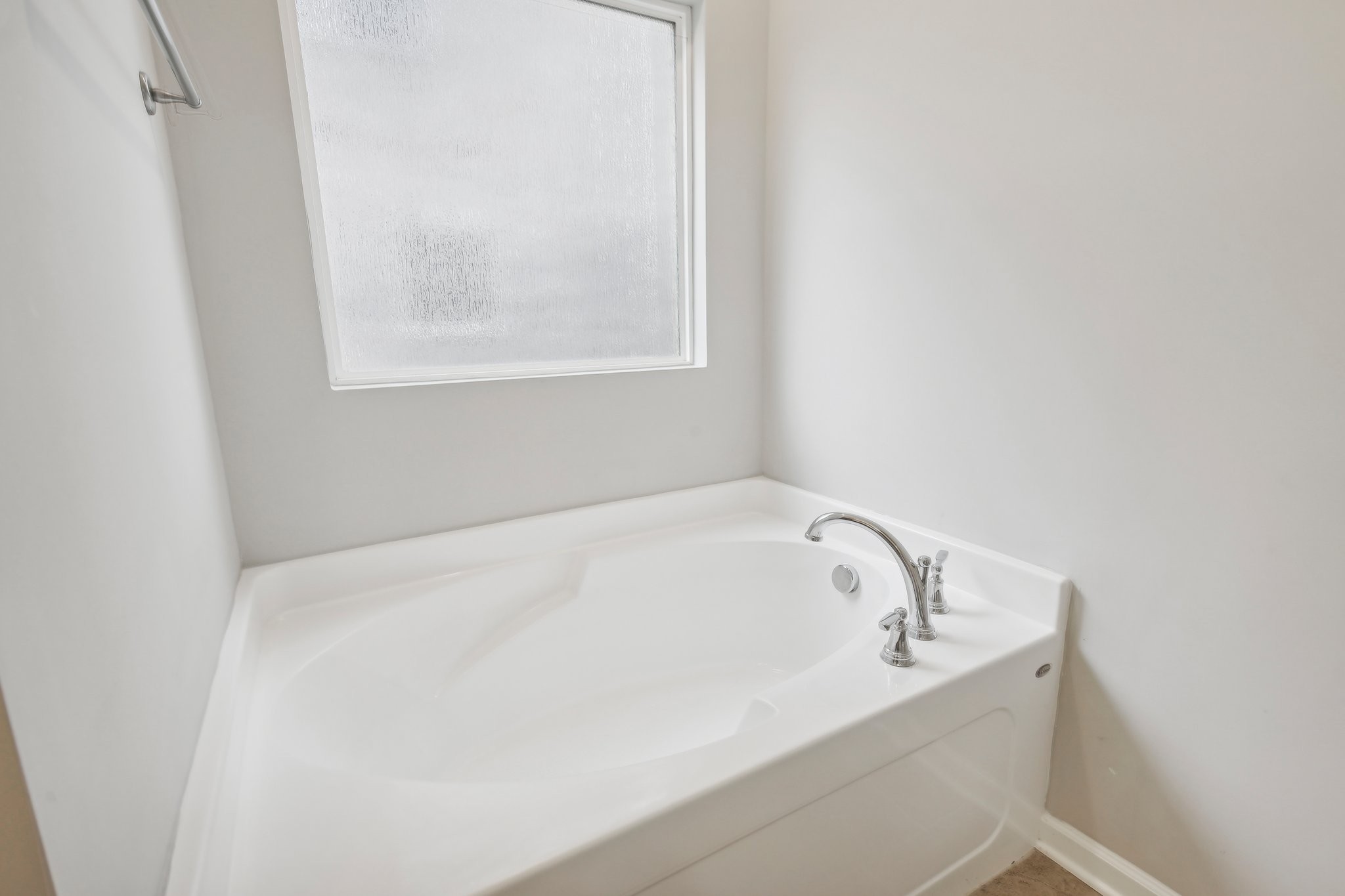 211 Thorpe Dr Spring Hill Spring Hill, TN 37174 - Photo 23 of 38 a white bath tub sitting in a bathroom