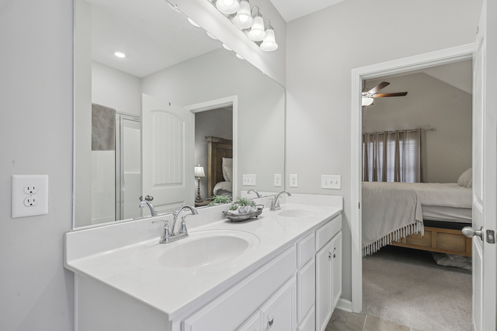 211 Thorpe Dr Spring Hill Spring Hill, TN 37174 - Photo 24 of 38 a en suite bathroom with a double vanity sink and a mirror