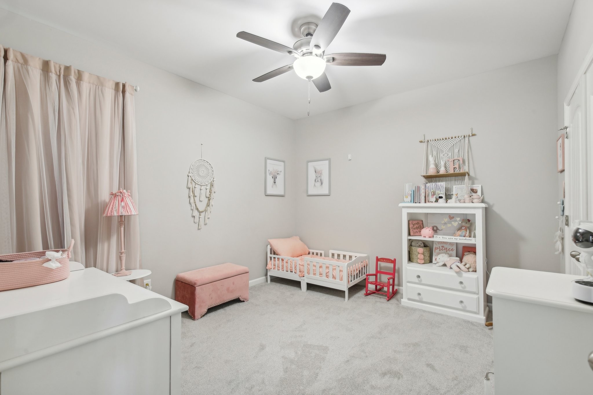 211 Thorpe Dr Spring Hill Spring Hill, TN 37174 - Photo 27 of 38 a bedroom with furniture and a chandelier